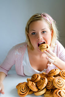 girl eating cinnamon buns