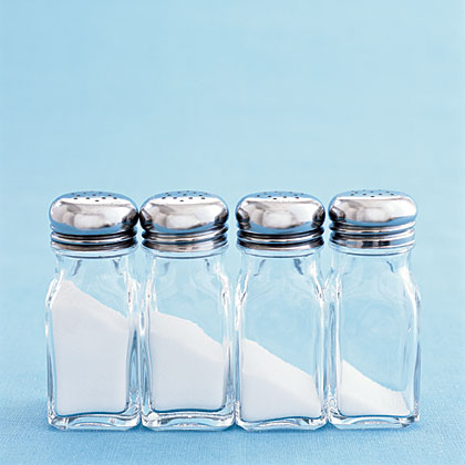 4 Salt Shakers with Decreasing Amounts of Salt