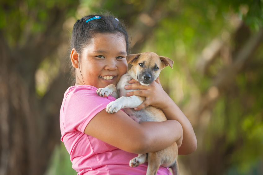 smiling girl with dog